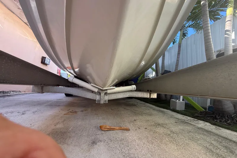 Slide: The Image of 1996 Grady-White Sailfish 272 boat hull on trailer, viewed from below. - 15