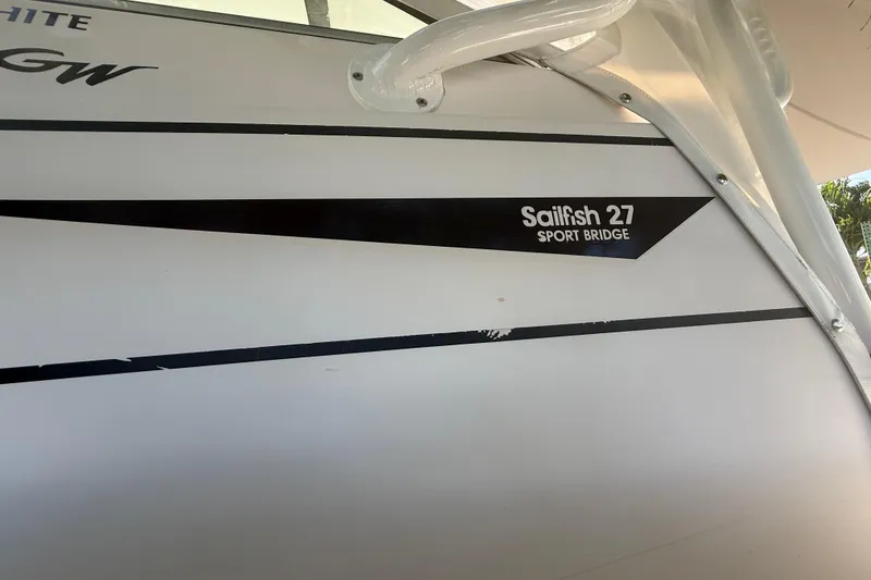 Slide: The Image of 1996 Grady-White Sailfish 272 boat, featuring "Sailfish 27 Sport Bridge" branding. - 16