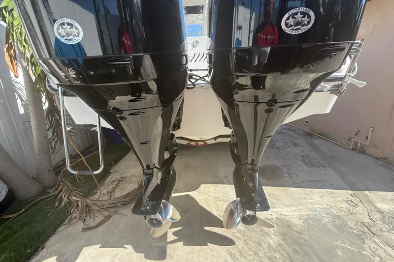 Slide: The Image of Twin outboard motors on a 1996 Grady-White Sailfish 272 boat, showcasing ultra-low emission technology. - 19