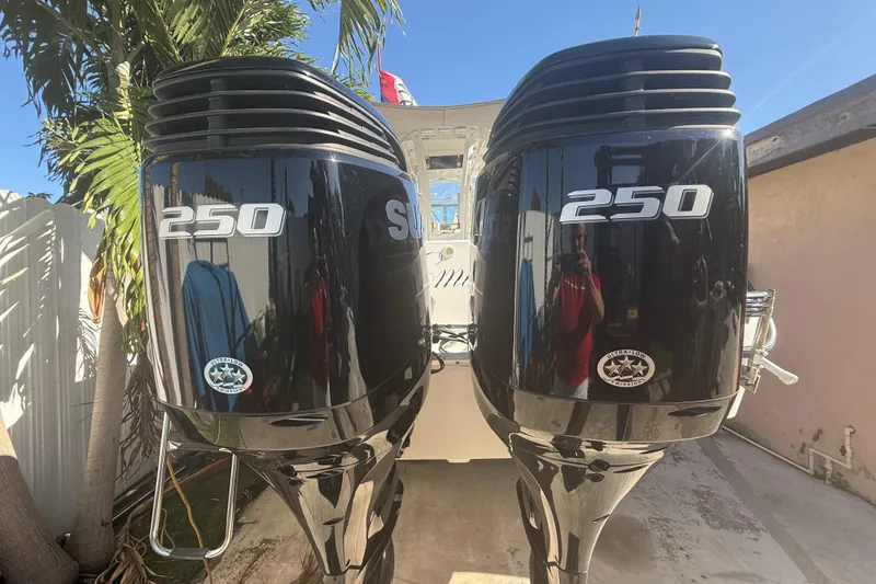 Slide: The Image of Twin 250 horsepower outboard engines on a 1996 Grady-White Sailfish 272 boat. - 20