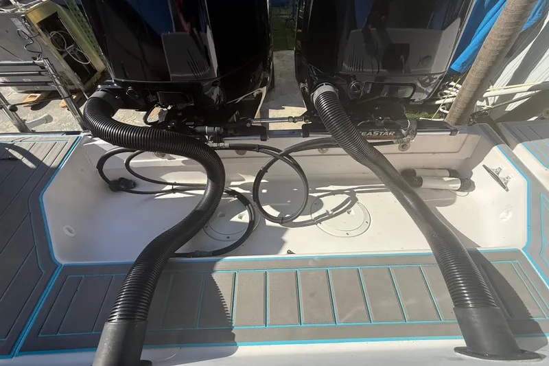 Slide: The Image of 1996 Grady-White Sailfish 272 boat with dual outboard motors and hydraulic steering system. - 25