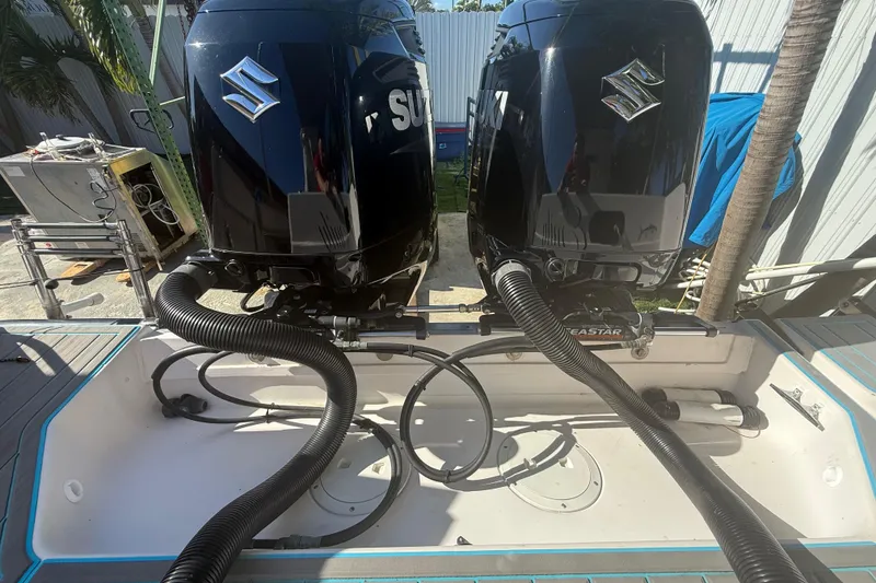 Slide: The Image of Twin Suzuki outboard engines on a 1996 Grady-White Sailfish 272 boat. - 26
