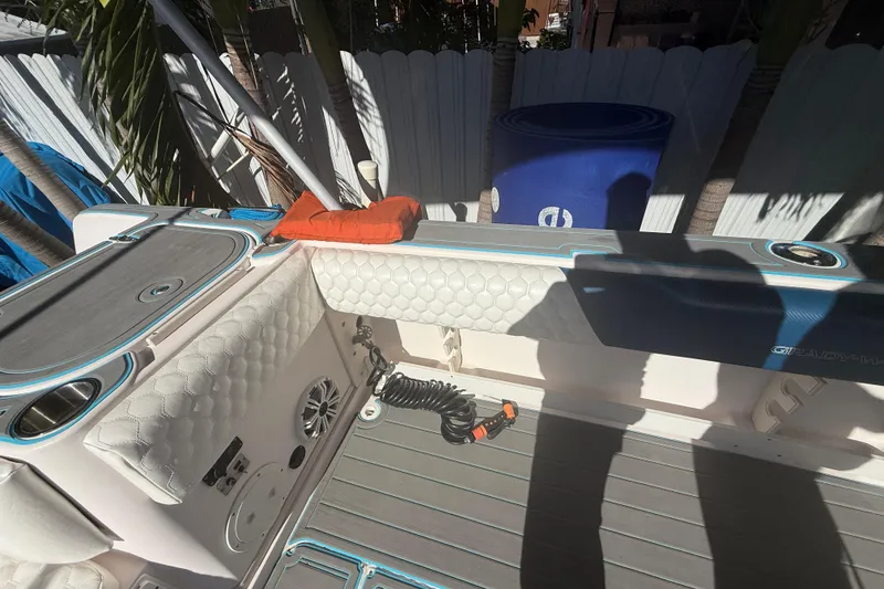 Slide: The Image of 1996 Grady-White Sailfish 272 boat interior with cushioned seating and deck details. - 38