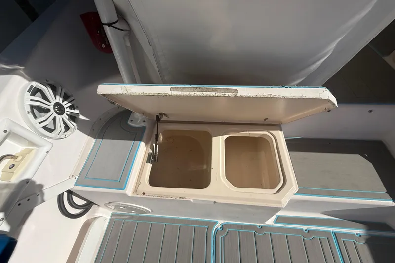 Slide: The Image of Open storage compartment on 1996 Grady-White Sailfish 272 boat deck. - 43