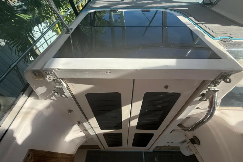 Slide: The Image of Interior view of a 1996 Grady-White Sailfish 272 boat cabin with closed hatch. - 53