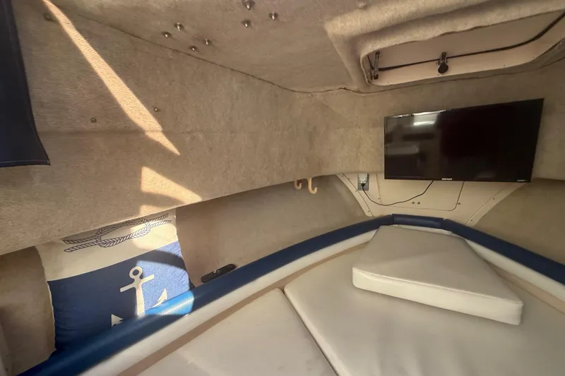 Slide: The Image of Interior cabin of 1996 Grady-White Sailfish 272 with TV and nautical decor. - 63