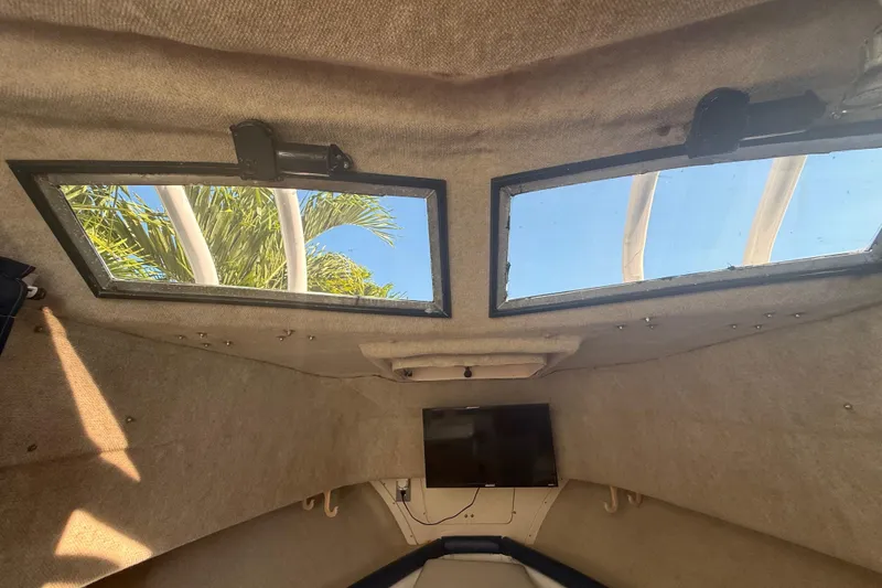 Slide: The Image of Interior view of 1996 Grady-White Sailfish 272 cabin with windows and ceiling details. - 71