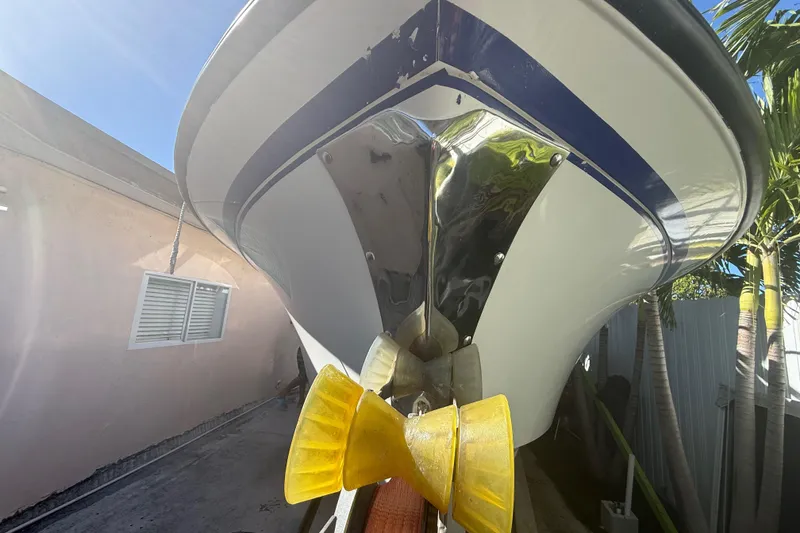 Slide: The Image of 1996 Grady-White Sailfish 272 boat hull with yellow bow protectors, outdoor setting. - 8