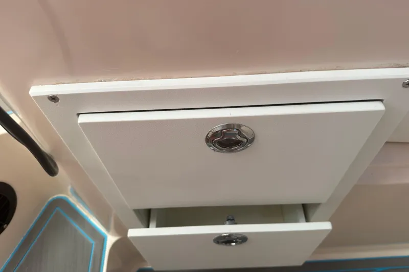 Slide: The Image of Storage compartment on a 1996 Grady-White Sailfish 272 boat interior. - 83