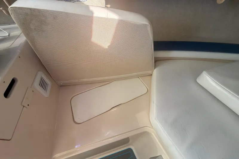 Slide: The Image of Interior view of a 1996 Grady-White Sailfish 272 boat cabin seating area. - 84