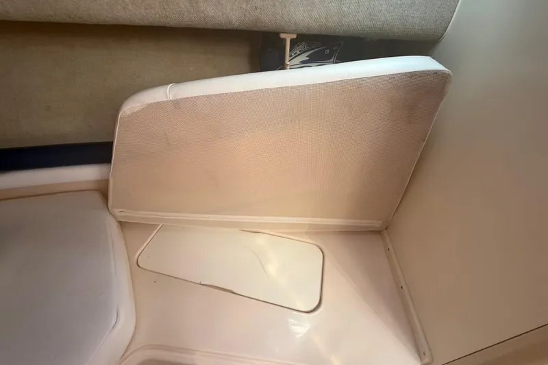 Slide: The Image of Interior view of a 1996 Grady-White Sailfish 272 boat cabin with seating area. - 85