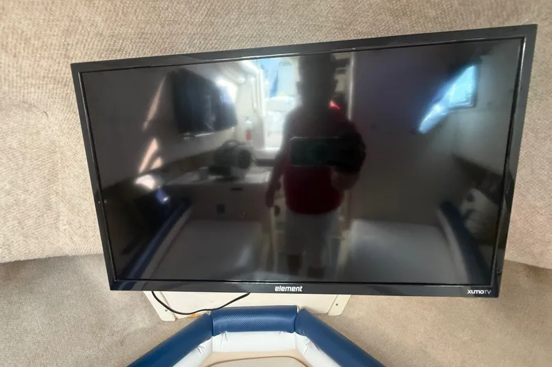 Slide: The Image of Flat-screen TV inside 1996 Grady-White Sailfish 272 boat cabin. - 87