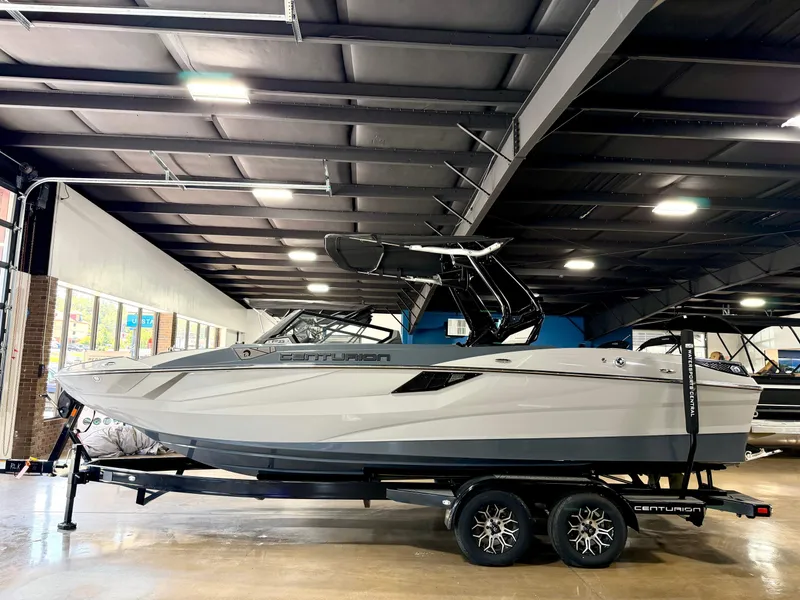 The Image of 2025 Centurion Fe23 boat in an indoor showroom. - 1