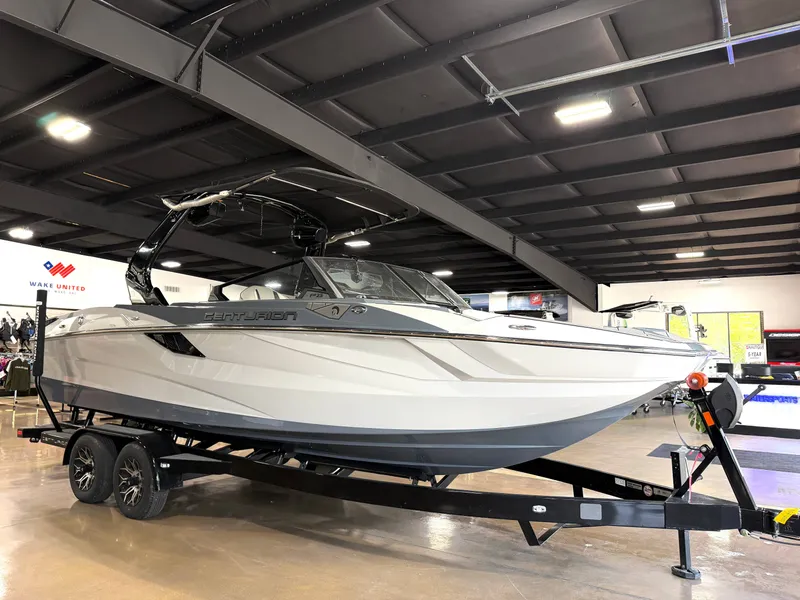 Slide: The Image of 2025 Centurion Fe23 boat in showroom on trailer. - 3