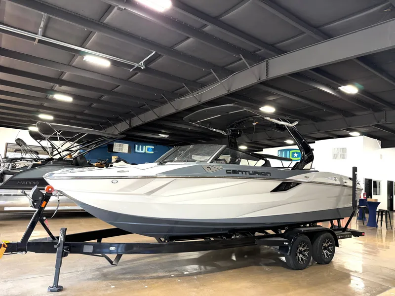 Slide: The Image of 2025 Centurion Fe23 boat in an indoor showroom. - 4