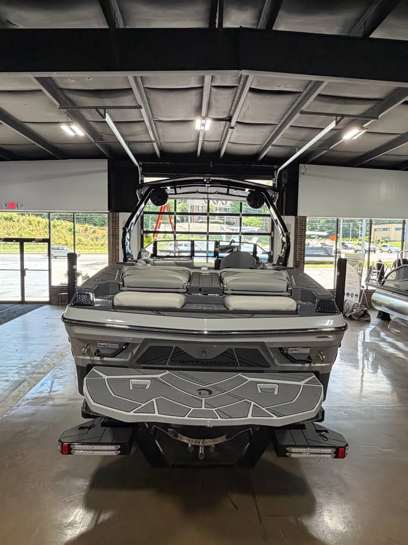 Slide: The Image of 2025 Centurion Fe23 boat parked indoors. - 5