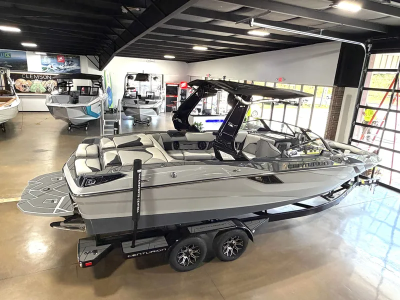 Slide: The Image of 2025 Centurion Fe23 boat in showroom on trailer. - 6