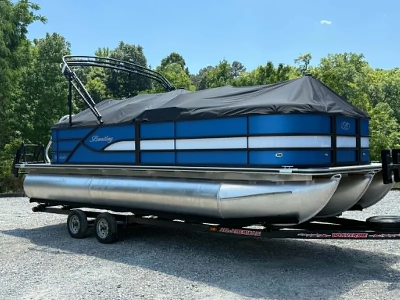 Slide: The Image of 2026 Bentley Pontoons Legacy 223 Navigator on trailer outdoors. - 13