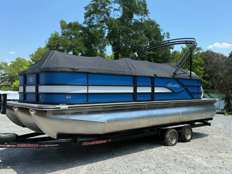 Slide: The Image of 2026 Bentley Pontoons Legacy 223 Navigator on trailer, blue, covered. - 25