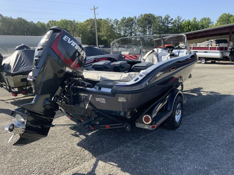 Slide: The Image of 2018 Ranger 1850MS Reata boat with Evinrude motor outdoors. - 11