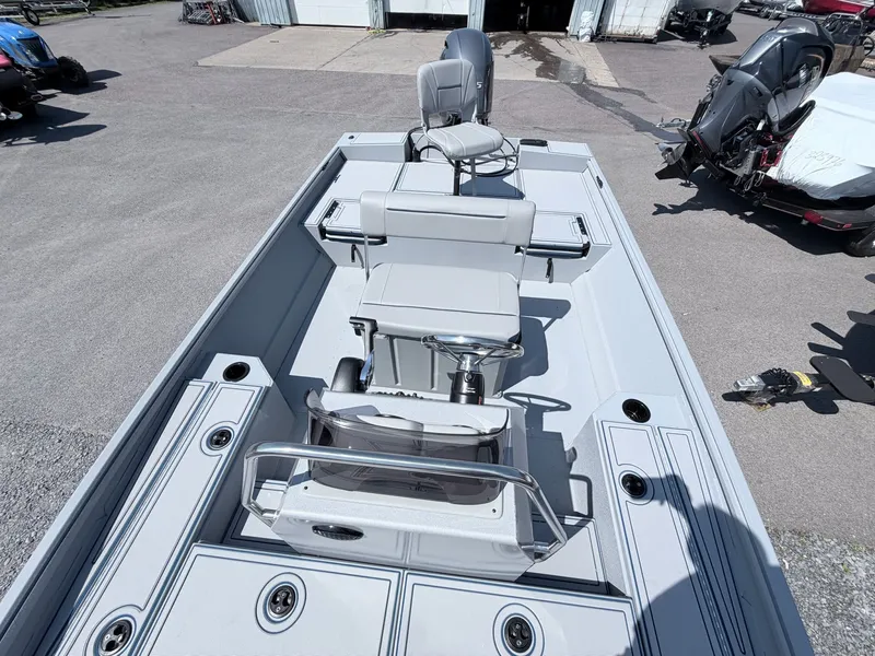 Slide: The Image of 2026 G3 Gator Tough 20CCJ DLX boat with gray seats and steering console. - 15