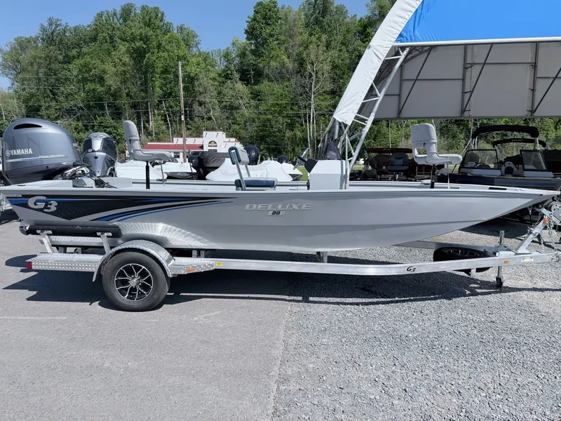 Slide: The Image of 2026 G3 Gator Tough 20CCJ DLX boat on trailer outdoors. - 17