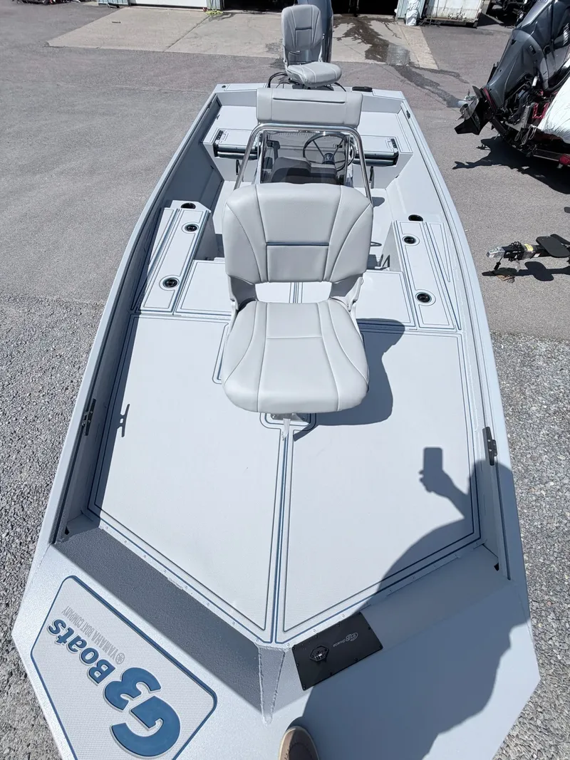 Slide: The Image of 2026 G3 Gator Tough 20CCJ DLX boat with gray seats. - 9