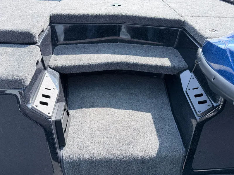 Slide: The Image of Interior of a 2022 Skeeter ZX200 boat with gray carpeting. - 11