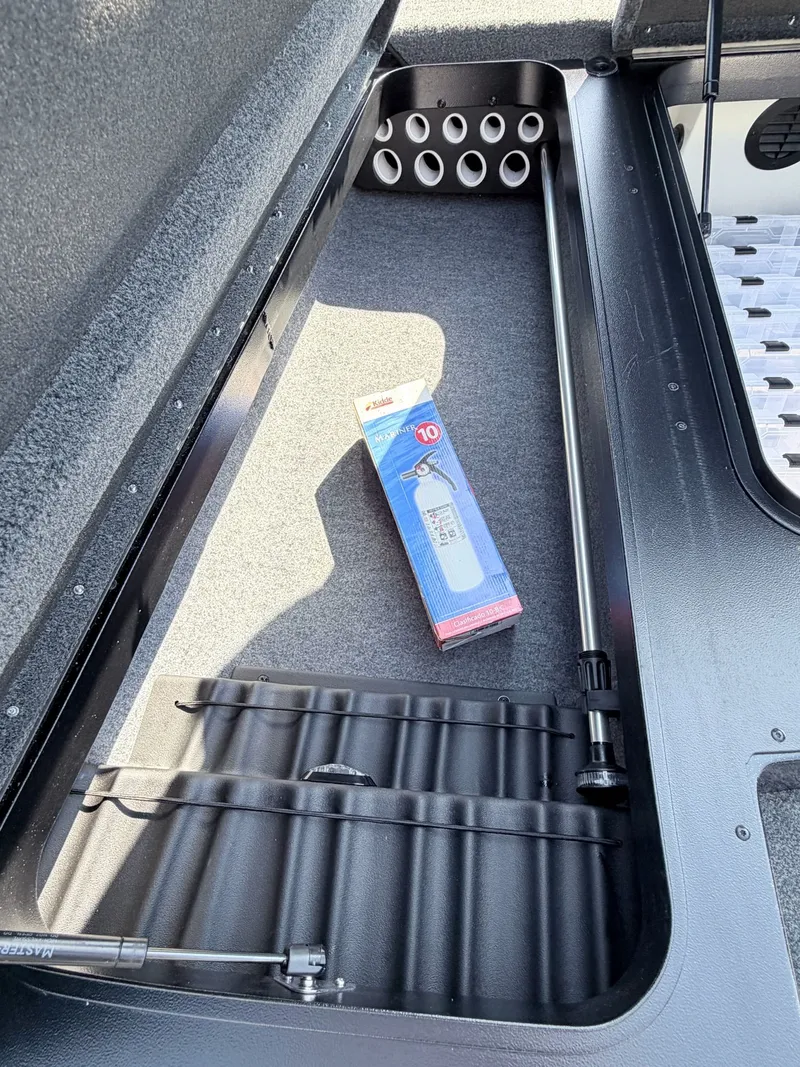 Slide: The Image of Interior of 2022 Skeeter ZX200 with storage compartment and accessories. - 13