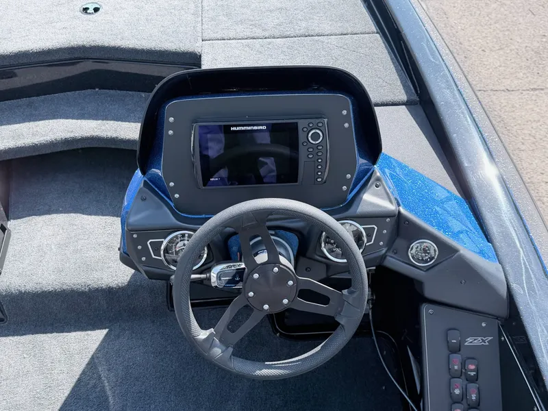 Slide: The Image of Skeeter ZX200 2022 boat console with Humminbird display and steering wheel. - 14