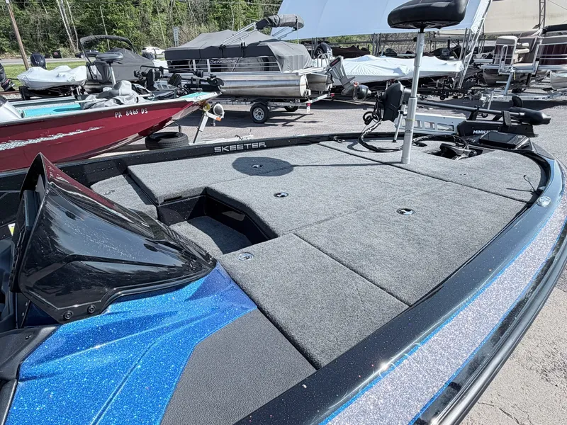 Slide: The Image of 2022 Skeeter ZX200 boat with spacious deck and fishing accessories. - 18