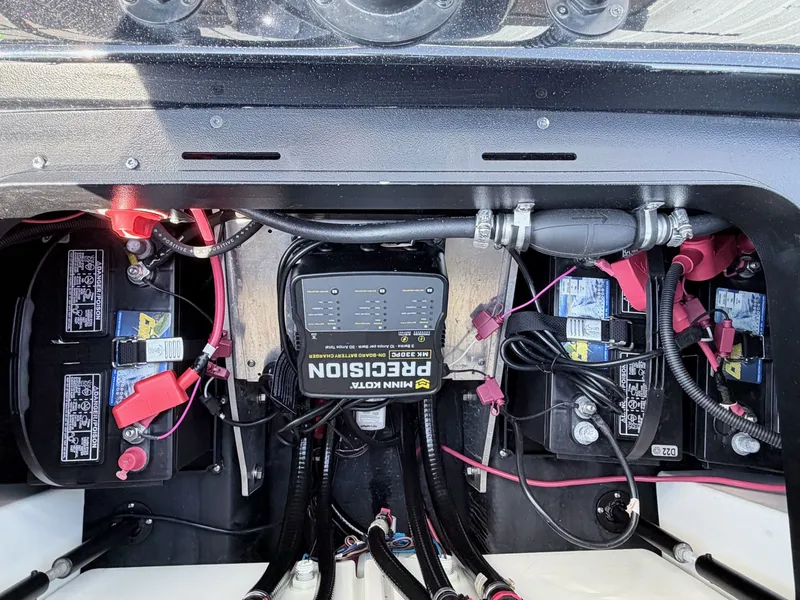 Slide: The Image of Battery compartment of a 2022 Skeeter ZX200 boat with Minn Kota charger. - 24