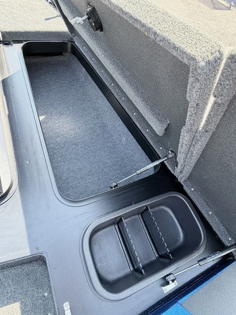 Slide: The Image of Interior of a 2022 Skeeter ZX200 boat with storage compartment. - 25