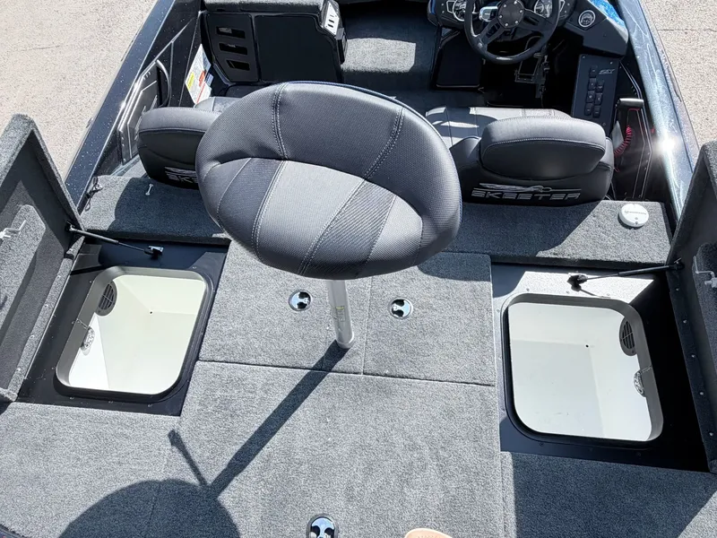 Slide: The Image of Interior of a 2022 Skeeter ZX200 boat with seating and storage compartments. - 4