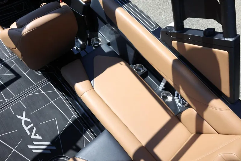 Slide: The Image of 2021 ATX Surf Boats 22 Type-S interior with tan seating and cup holders. - 16
