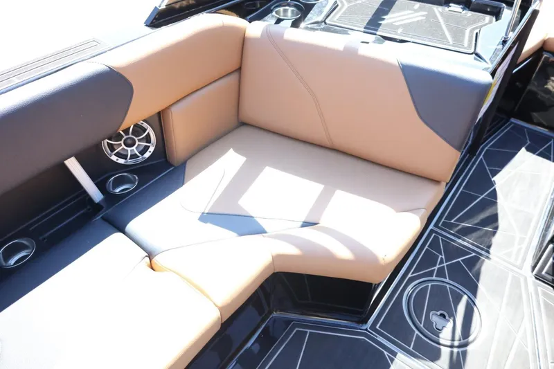 Slide: The Image of 2021 ATX Surf Boats 22 Type-S interior seating with tan and black upholstery. - 17