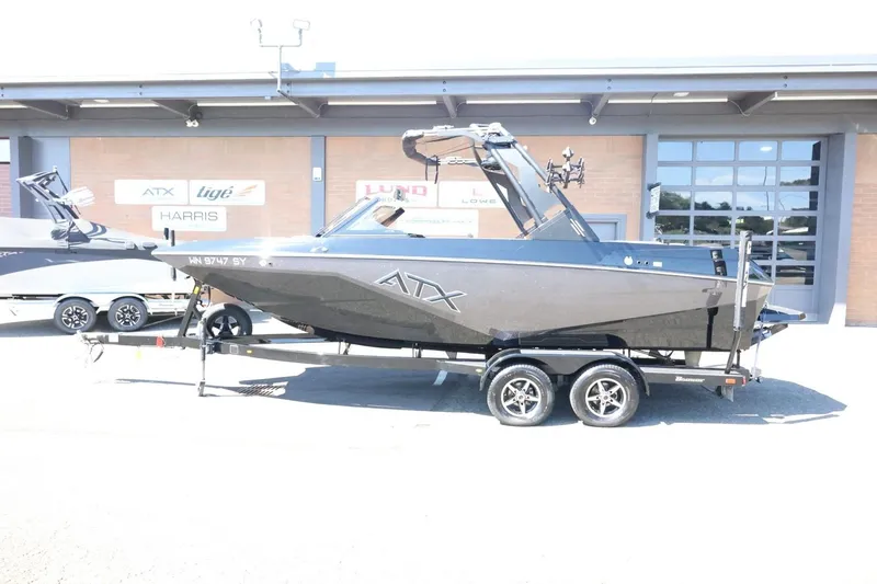 Slide: The Image of 2021 ATX Surf Boats 22 Type-S on trailer, parked outside dealership. - 2