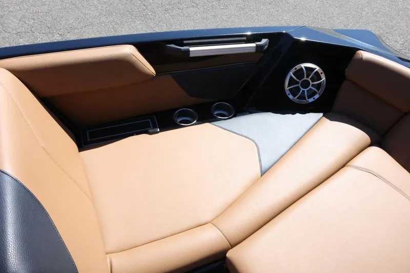 Slide: The Image of Luxurious interior of 2021 ATX Surf Boats 22 Type-S with tan seating and speaker. - 20