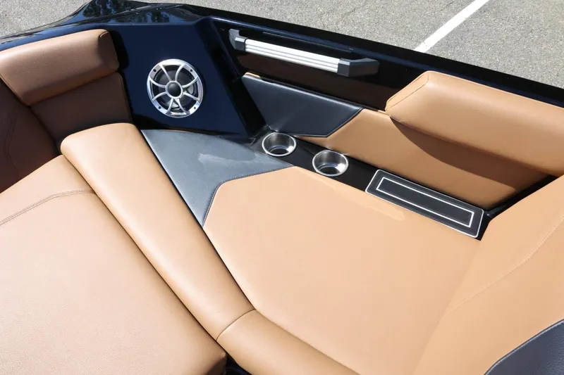 Slide: The Image of Luxurious interior of 2021 ATX Surf Boats 22 Type-S with tan seating and speaker. - 21