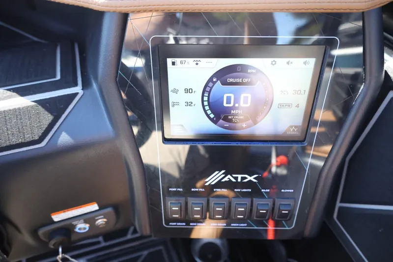 Slide: The Image of ATX Surf Boats 22 Type-S 2021 dashboard with digital display and control switches. - 25