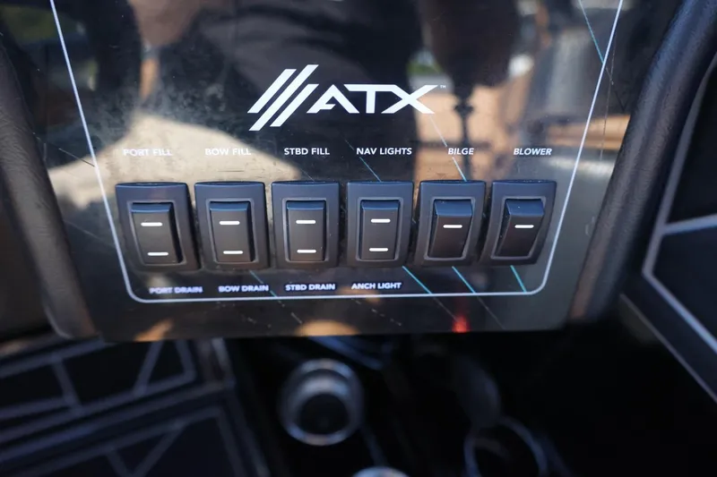 Slide: The Image of Control panel of 2021 ATX Surf Boats 22 Type-S with labeled switches. - 28