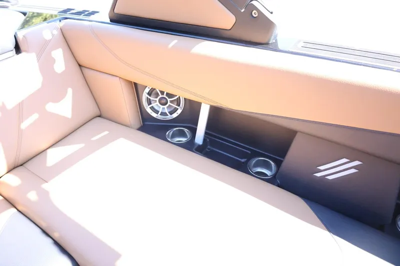 Slide: The Image of Interior of 2021 ATX Surf Boats 22 Type-S with tan seating and speaker system. - 35