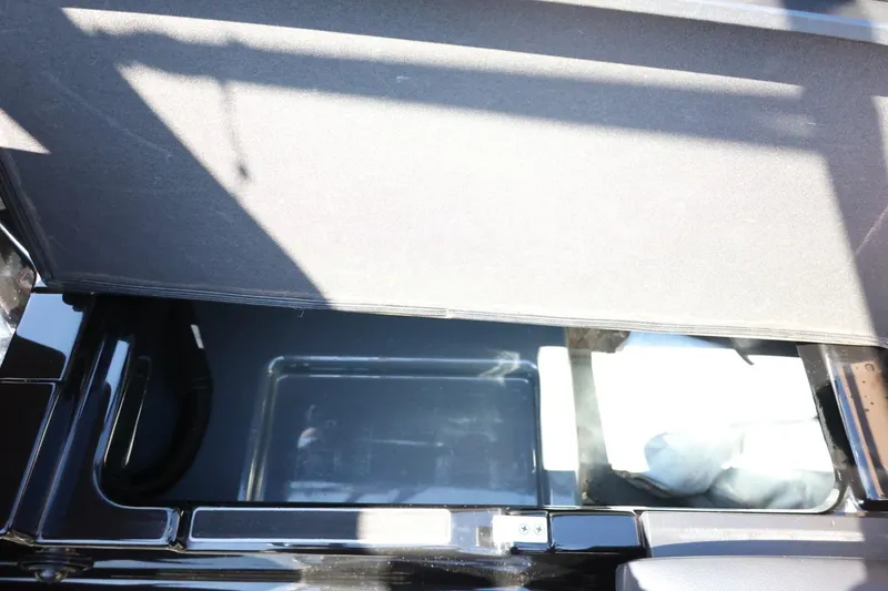 Slide: The Image of Open storage compartment in 2021 ATX Surf Boats 22 Type-S, showcasing interior space. - 38