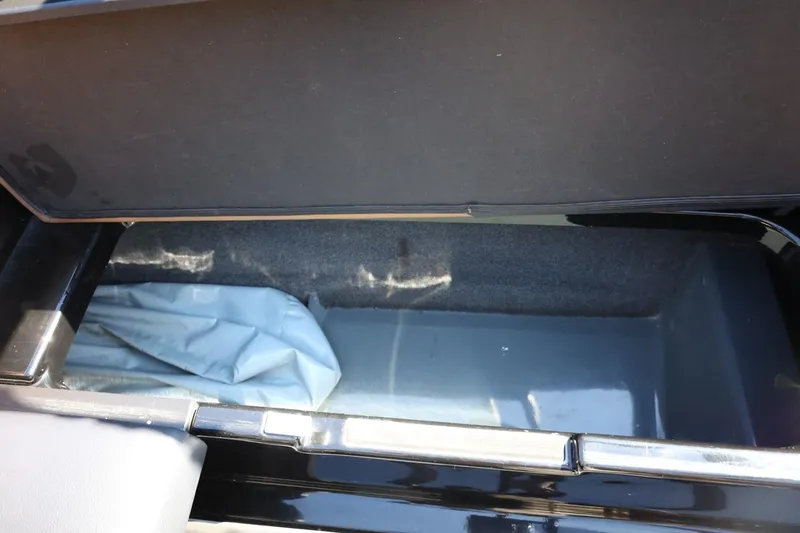 Slide: The Image of Storage compartment of 2021 ATX Surf Boats 22 Type-S, open and empty. - 39