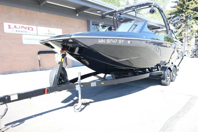 Slide: The Image of 2021 ATX Surf Boats 22 Type-S on trailer, parked outside a dealership. - 4
