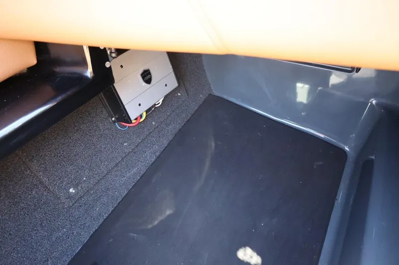 Slide: The Image of 2021 ATX Surf Boats 22 Type-S interior detail with wiring and carpeted flooring. - 41