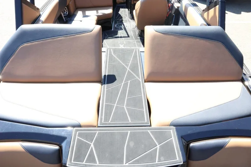 Slide: The Image of 2021 ATX Surf Boats 22 Type-S interior with tan and black seating, geometric design. - 48