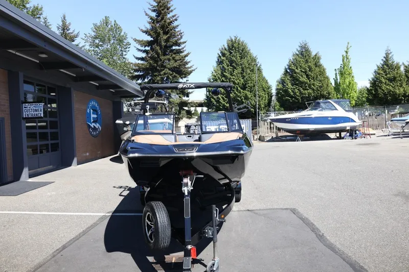 Slide: The Image of 2021 ATX Surf Boats 22 Type-S displayed outdoors at a marina. - 6