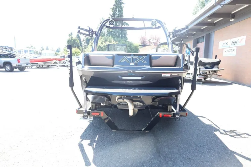 Slide: The Image of 2021 ATX Surf Boats 22 Type-S, rear view in a parking lot. - 9