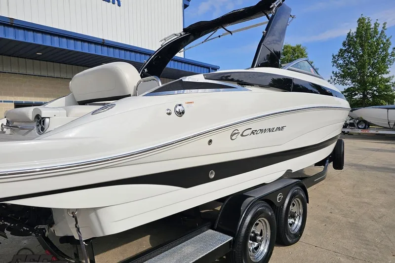 Slide: The Image of 2019 Crownline 275 SS boat on trailer, showcasing sleek design and modern features. - 10